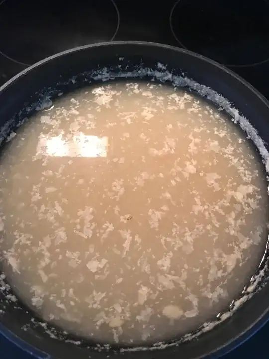 picture of toaster with tray full of crumbs sliding out