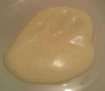 Cream on plate with black dots/specks/flakes