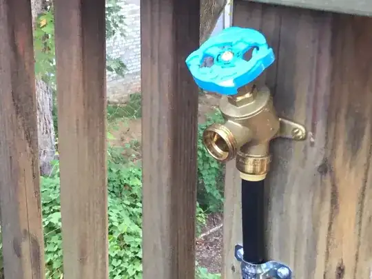 Picture of Sharkbite garden hose faucet connected to Rainbird 1/2 inch tubing