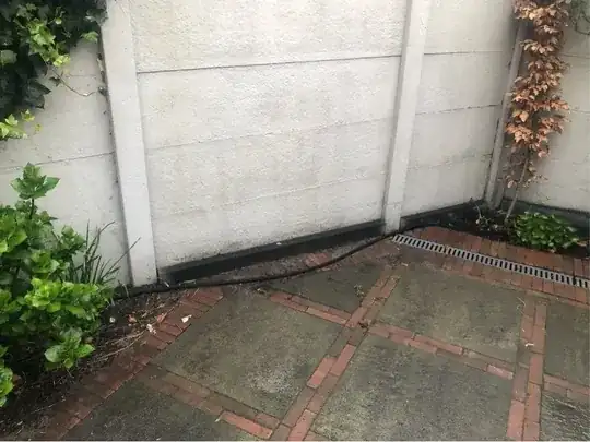 Soaker hose on the pavement