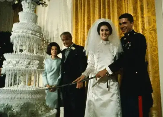 Wedding of Lynda Johnson and Chuck Robb in the East Room, with golden curtains visible in the background