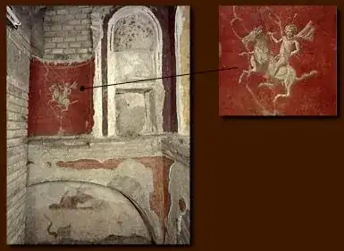 wall of Tomb U showing a guy on a horse on a red background
