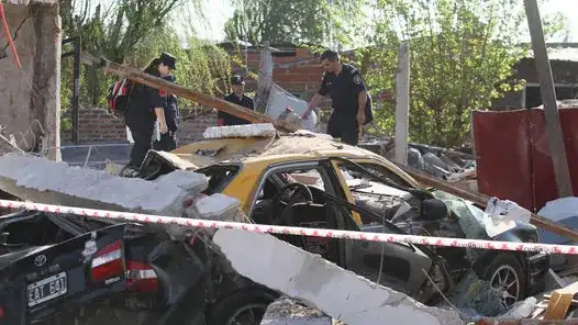 something is damaged, and a car and persons in between