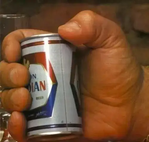 Andre the Giant holding a beer can