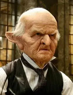 Andy Herd playing a wrinkled goblin with a hook nose