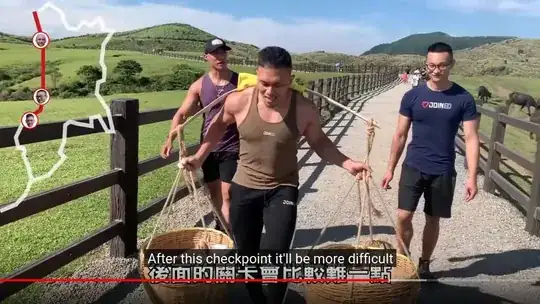 screenshot of the three men and the 100kg weight