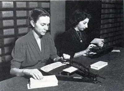 Women creating punch cards