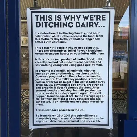 poster in shop window of British cafe