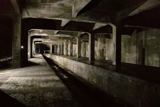 Cincinnati Subway - Race St. Station Abandoned under Central Parkway as part of the Cincinnati Subway System. In the middle is the interurban line which does not allow a train/trolley to travel straight through the station. In the distance and not lit in the photograph is the other equally large half of the station.