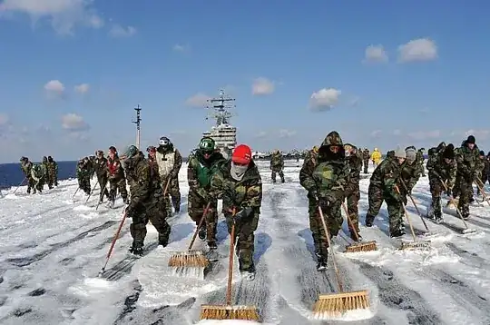 US Navy Sailors scrubbing down the deck ID 10323-N-DM338-113