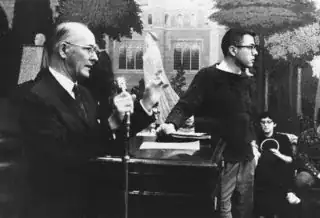 Bernie Sanders (standing), then a college student at the University of Chicago, leads his classmates in a sit-in to protest segregated housing for black students. (Danny Lyon/Special Collections Research Center, University of Chicago Library)