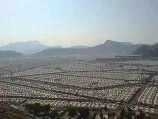 Photo from mountainside of the tented areas covering the Plain of Mina, Saudi Arabia