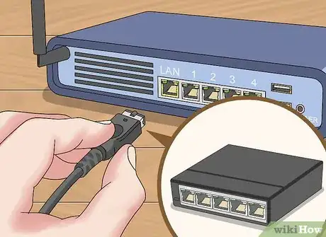 Step 5 Conecte o switch a uma porta LAN no roteador.